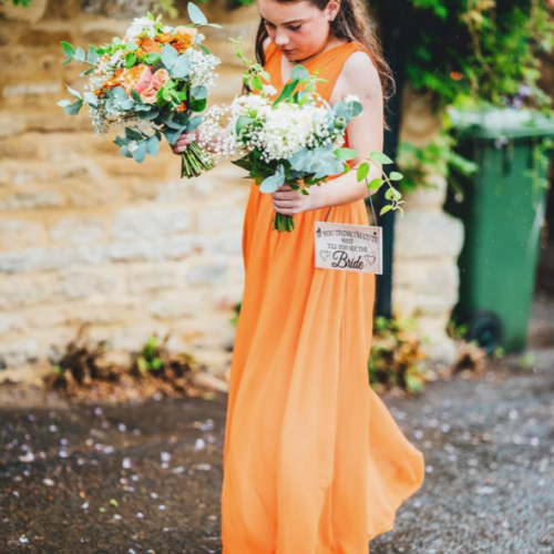 Bridesmaid with bouquets JUL23