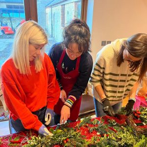 Di helping with wreath